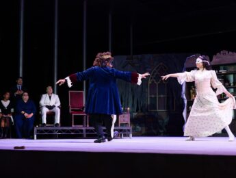 Actors perform on stage