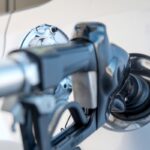 A fuel pump nozzle in a vehicle gas tank.