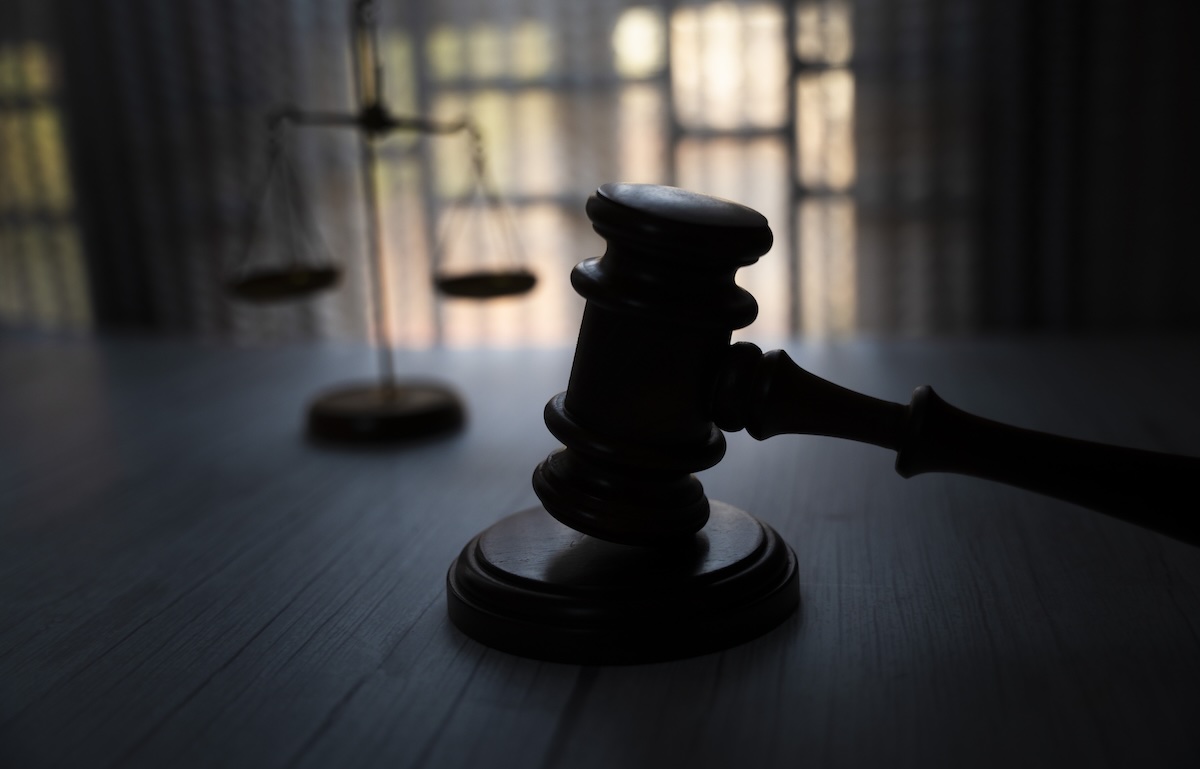 Silhouette of gavel and justice scale