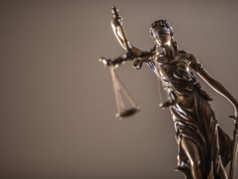 Statue of the lady of justice with scales close-up.