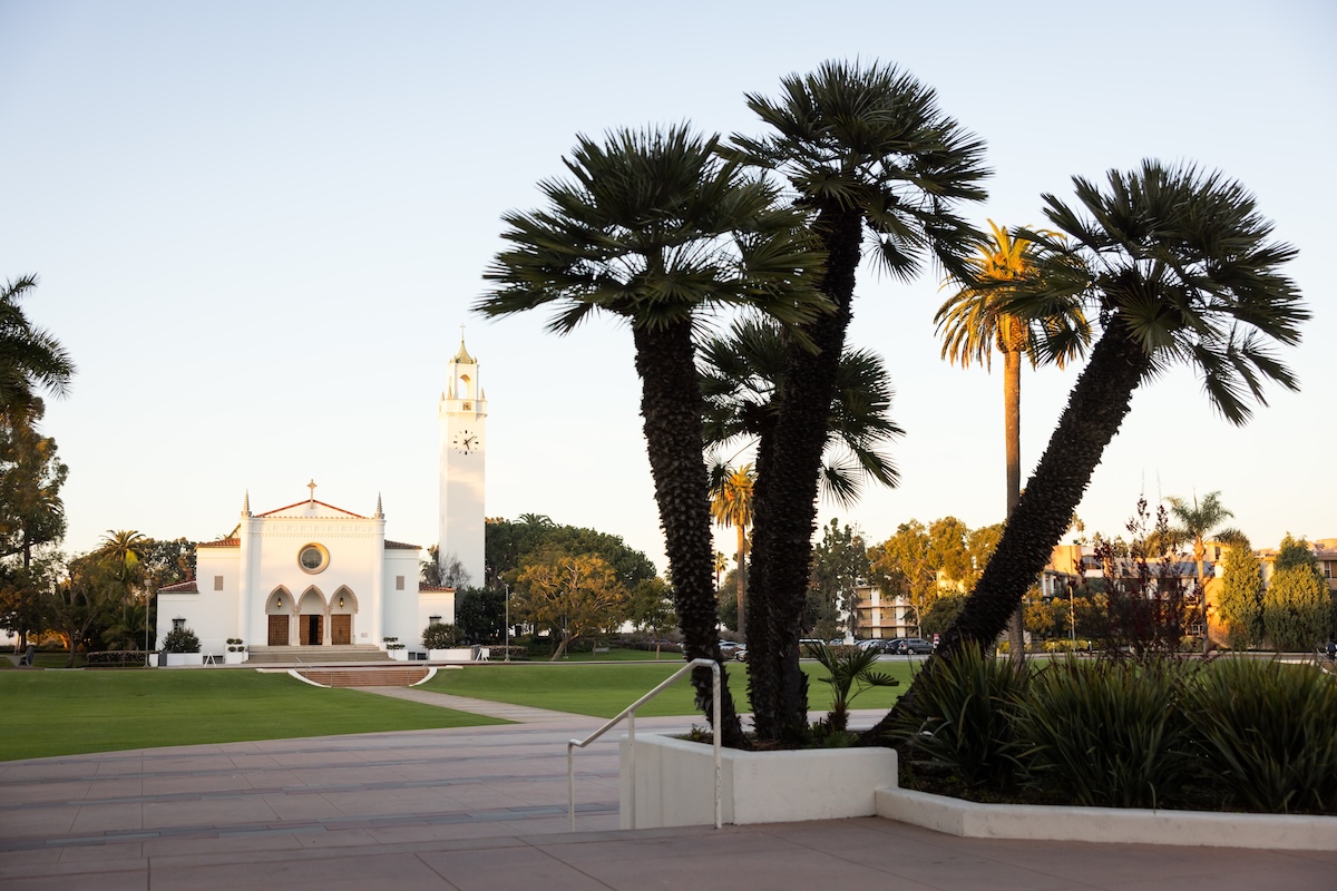 Three palm trees in front of LMU's Sacred Heart Chapel