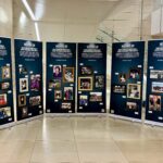 The Inclusive History and Images Project exhibition shows large posters with archival photos of academic and social events at LMU.