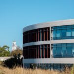 Photo of LMU William H. Hannon Library with the Sacred Heart Chapel in the Background