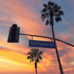 Hollywood street sign and traffic light with Palmtrees, Los Angeles
