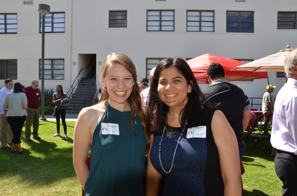 Two students smiling for a photo at the CIP Mixer