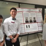 LMU students pose with their research poster