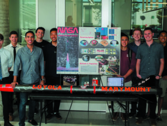 Seaver students, their research poster, and demonstration table