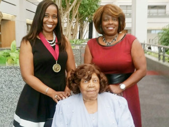 Enikia Ford-Morthel (left), poses with family after LMU Faculty Awards Ceremony
