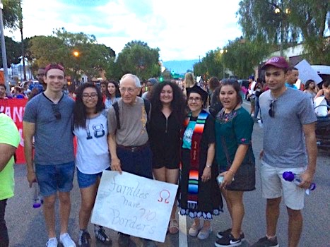 Cecilia Gonazalez-Andrieu with LMU alumni and artist John August Swanson at a pro-DACA march in downtown L.A.