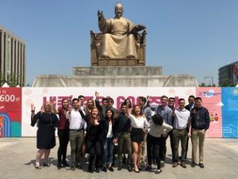 LMU students, faculty and staff in front of the King Sejong monument in Seoul, Korea