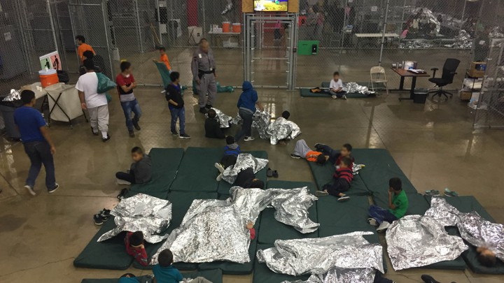 Children in foil sleeping bags at border control