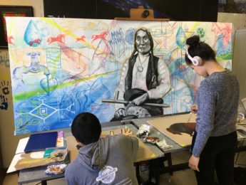 Student working on indigenous art
