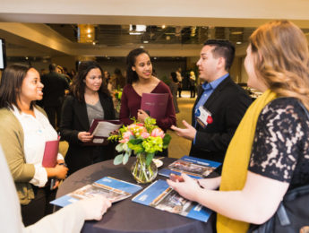 Students and alumni engaged in conversation around a table at BCLA Career Chats event