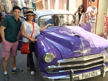 EMBA students check out the classic cars in Cuba