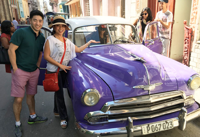 EMBA students check out the classic cars in Cuba