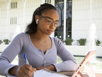An LMU student studying via Zoom