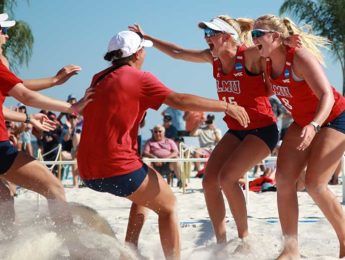 Women’s beach volleyball players celebrate during the NCAA Tournament in Gulf Shores, Alabama, in May 2021. LMU beach volleyball won the West Coast Conference championship for the second-consecutive season and advanced to the NCAA Tournament Semifinals for the first time in program history.