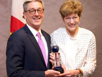 Image of LMU President Timothy Law Snyder, Ph.D., accepting PCI award