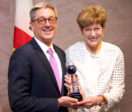 Image of LMU President Timothy Law Snyder, Ph.D., accepting PCI award