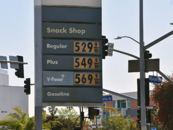 gas prices on sign at gas station