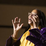Professor Kim R. Harris singing during the musical interlude at the Inaugural Global Conversation.