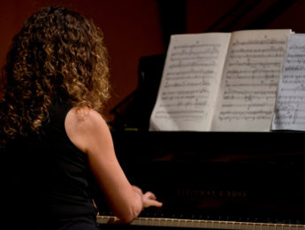 Image of woman playing piano