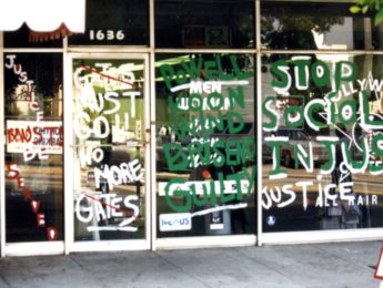 Storefront with messages about policy brutality in 1992 Los Angeles