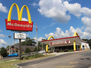 McDonald's sign with restaurant in background