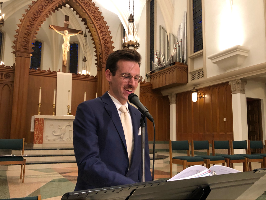 Image of student singing in Sacred Heart Chapel