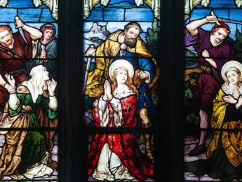 St. Patrick's Cathedral, Armagh, County Armagh, Northern Ireland. Lower lights of the second south-most stained glass window in the west aisle (liturgically south) by Meyer & Co. of Munich, depicting the martyrdom of St. Dympna