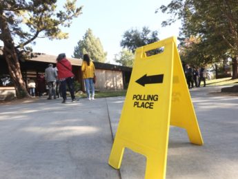 Sign pointing to voter polling place