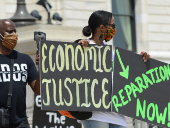Activists at a rally for reparations