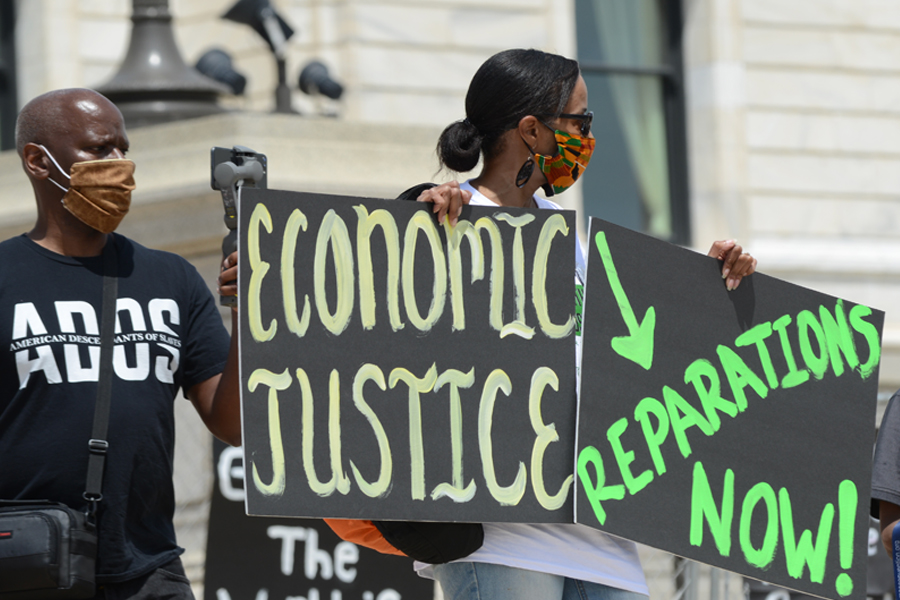 Activists at a rally for reparations