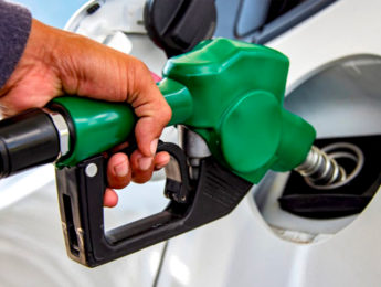 Customer pumping gas into car