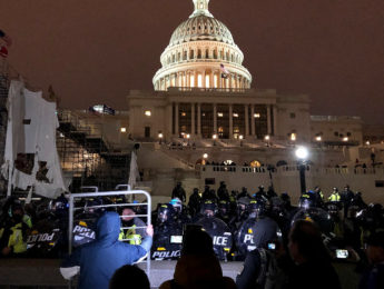 rioters in the U.S. Capitol in the evening