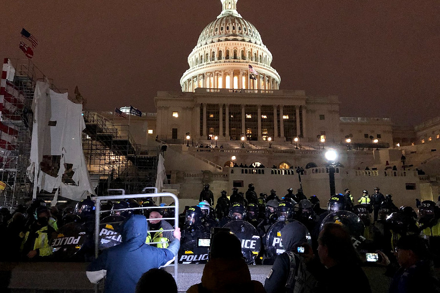 rioters in the U.S. Capitol in the evening