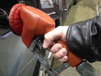 person pumping gas