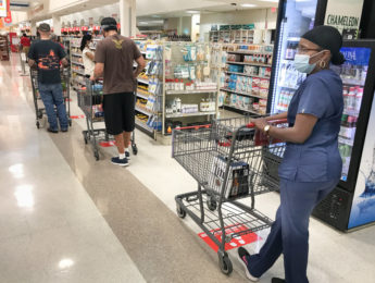 shopper in store in coronavirus mask