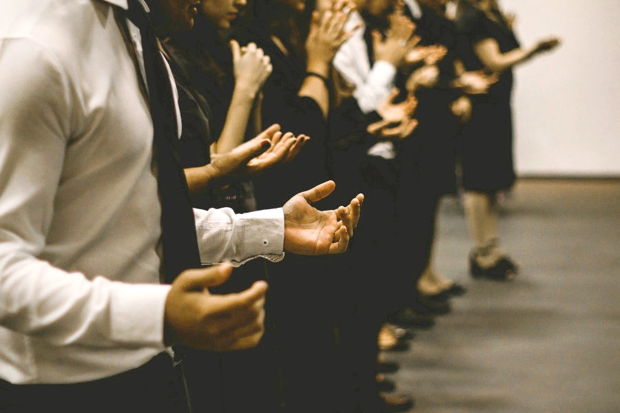 People praying with hands open