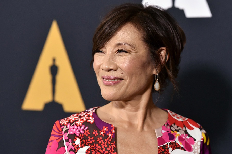 Janet Yang in front of Academy step and repeat