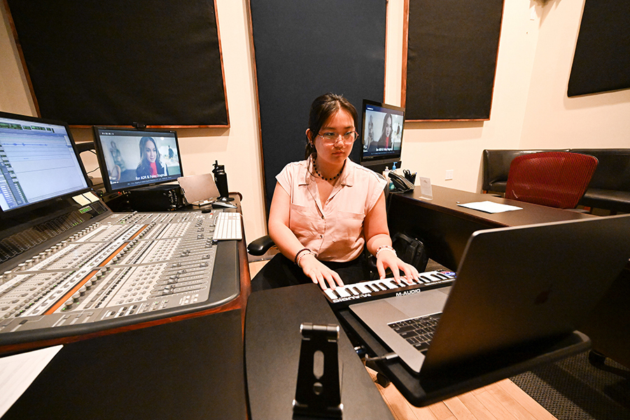 Zoe Cannon utilizing recording arts equipment at her internship