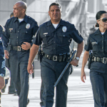 LAPD officers walking toward the camera
