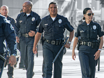 LAPD officers walking toward the camera