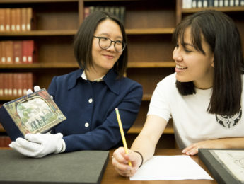 Archives and Special Collections Instruction Librarian Rachel Wen-Paloutzian with a student