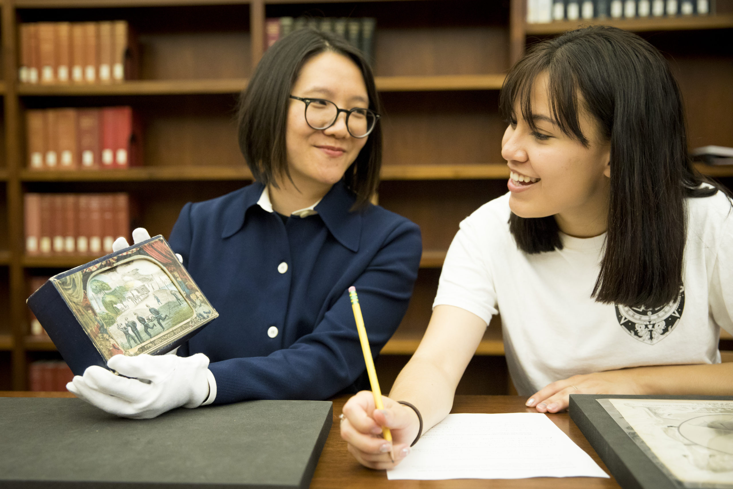 Archives and Special Collections Instruction Librarian Rachel Wen-Paloutzian with a student