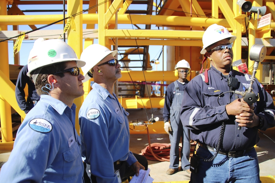 Industrial workers conducting workers conducting inspection