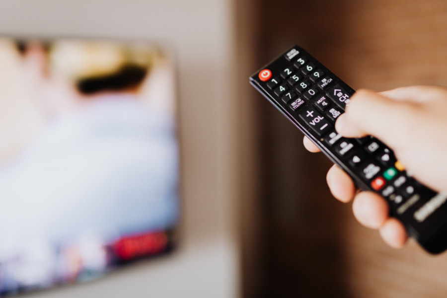 remote pointed at TV screen