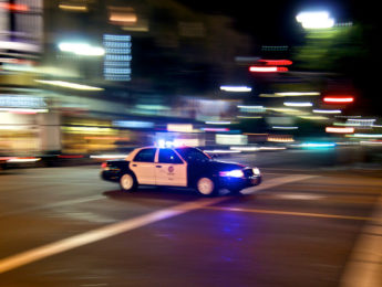 LAPD car at night with blurred background