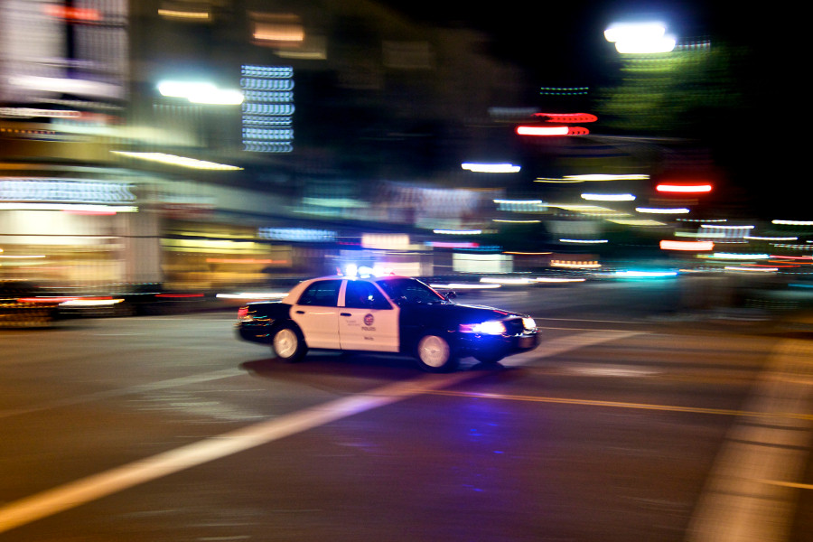 LAPD car at night with blurred background