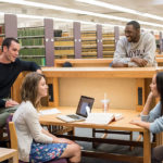 Students gathering in the William M. Rains Library at Loyola Law School